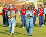 Anjum Chopra and Rumeli Dhar of India lead England off the field during the England v India Women's World Cup match on March 28, 2005, at Laudium Cricket Oval in Pretoria, South Africa. (Photo by: Getty)
